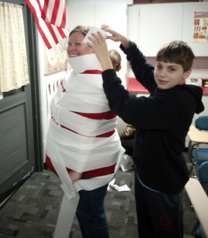 a student wrapping the principal in toilet paper 