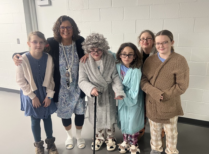 students and staff dressed up as 100-year-old people