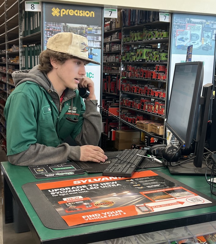 a high school student working at an auto store