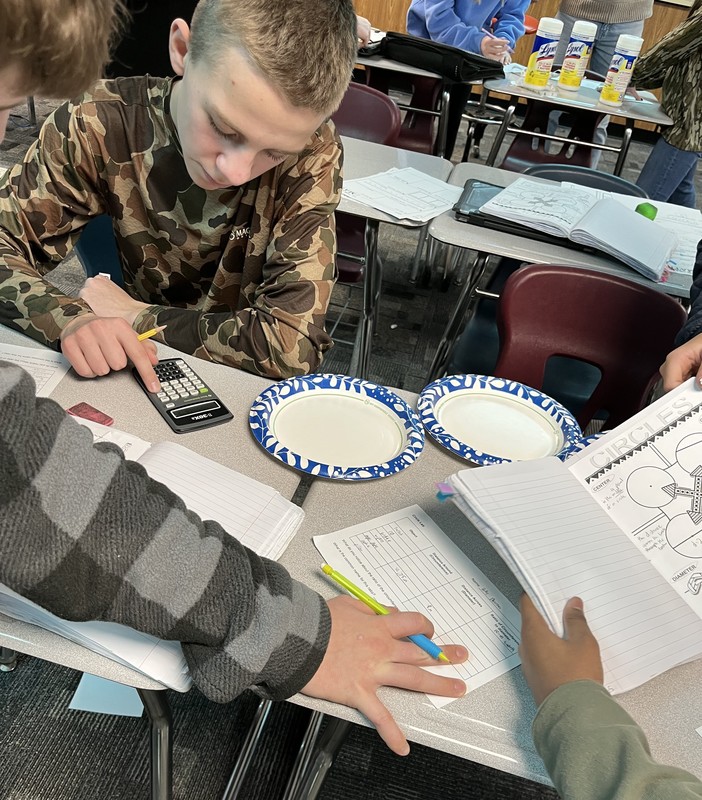 students figuring out the distance of a circle