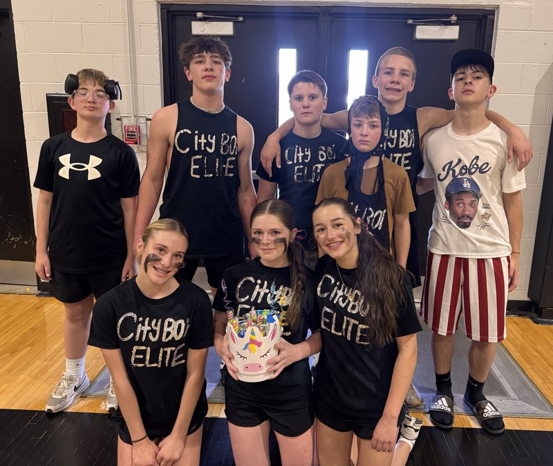 volleyball players sitting or standing in the gym