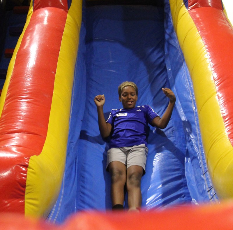 student going down a large slide