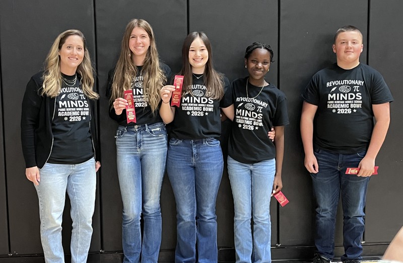 five people standing in a row with some holding ribbons