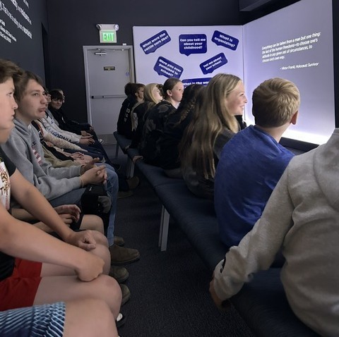 students looking at an exhibit