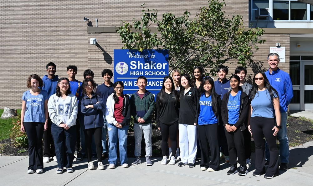 An image of 21 Shaker seniors who have been named Commended Students posing together with SHS Principal Marcus Puccioni.