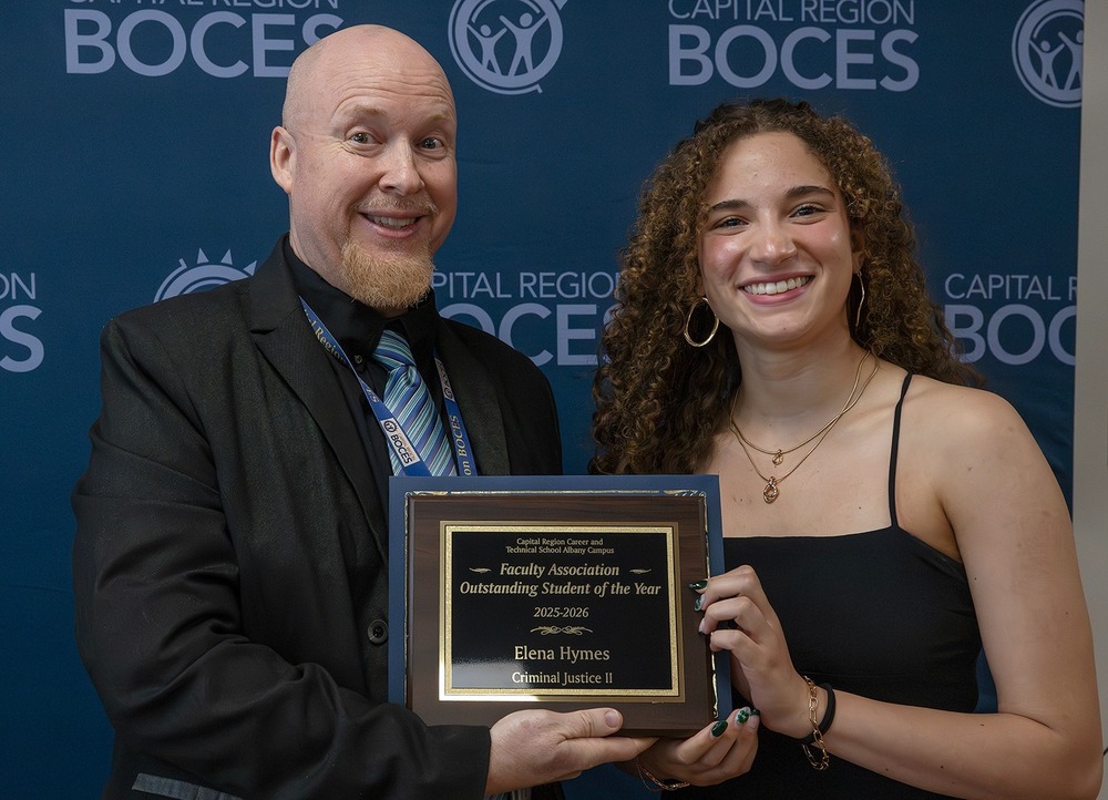 elena hymes a senior in the Criminal Justice program, pictured with teacher