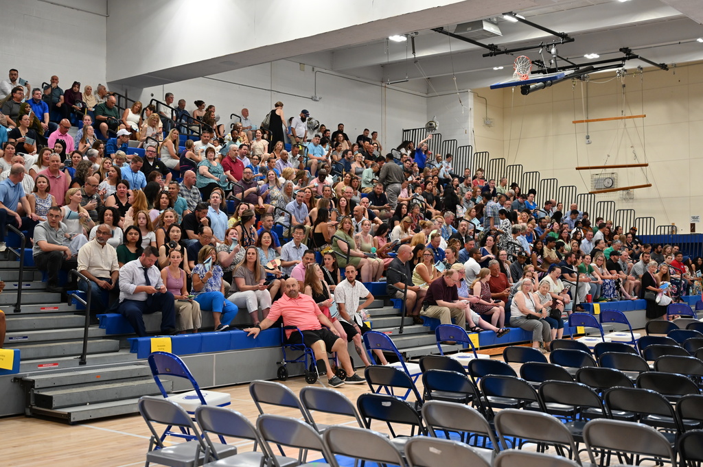 Family and friends watching graduation