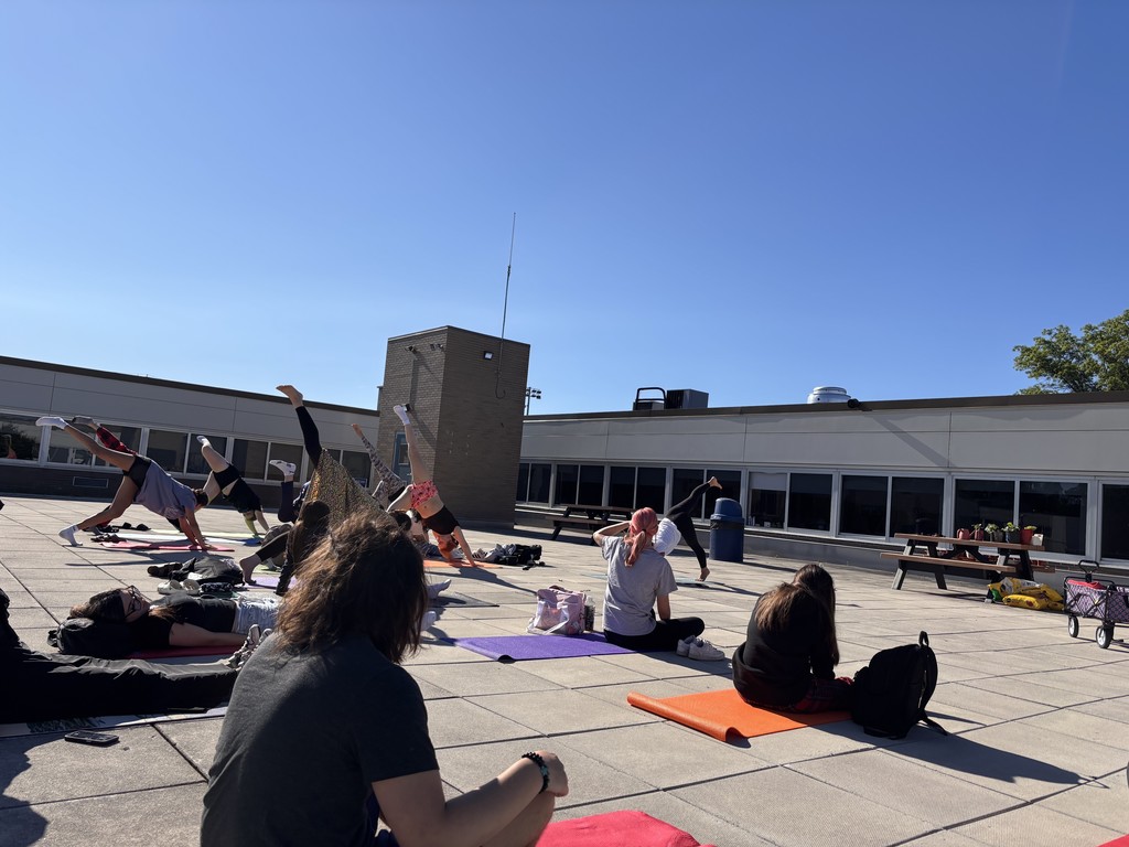 Summer school students doing morning yoga
