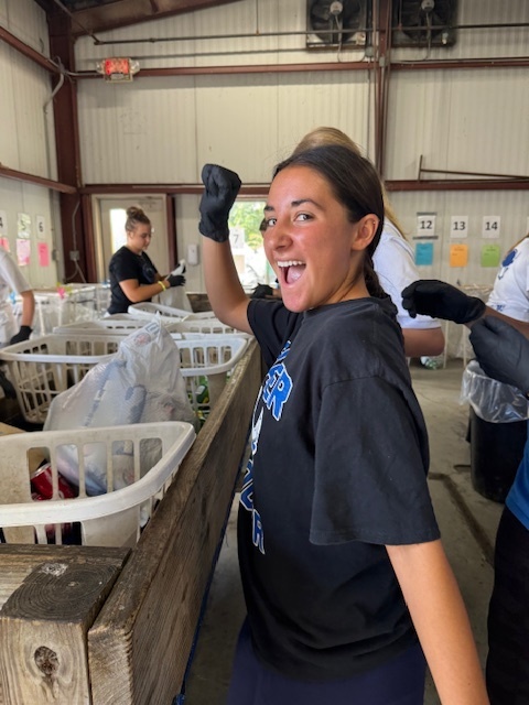 Girls soccer member excited to help!