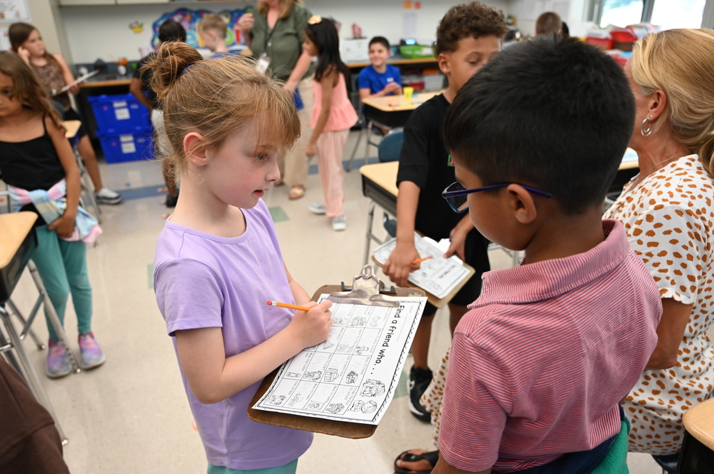 Two students get to know one another by asking questions about their interests.