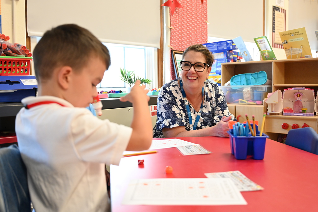 kathy and student smiling