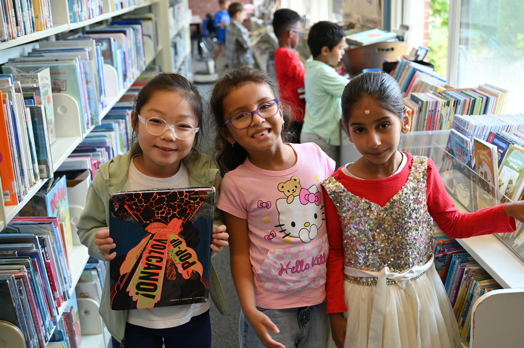 Student having fun on first day in the library