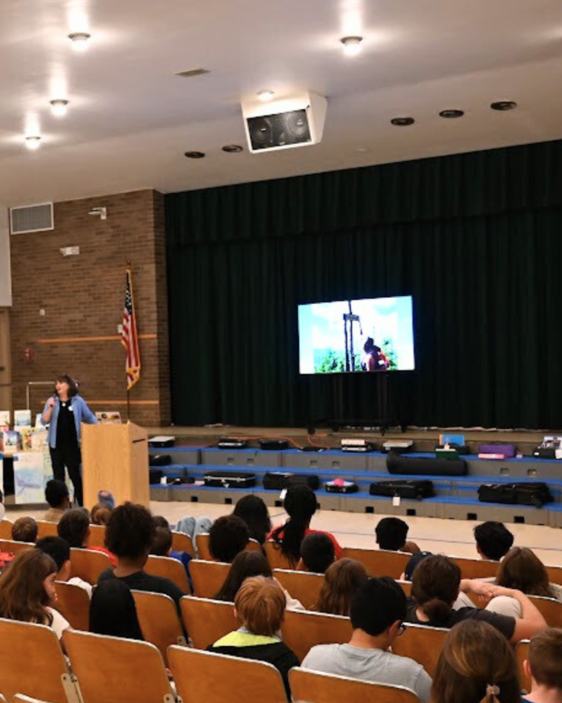 Kate Messner reading to Forts Ferry 5th graders 
