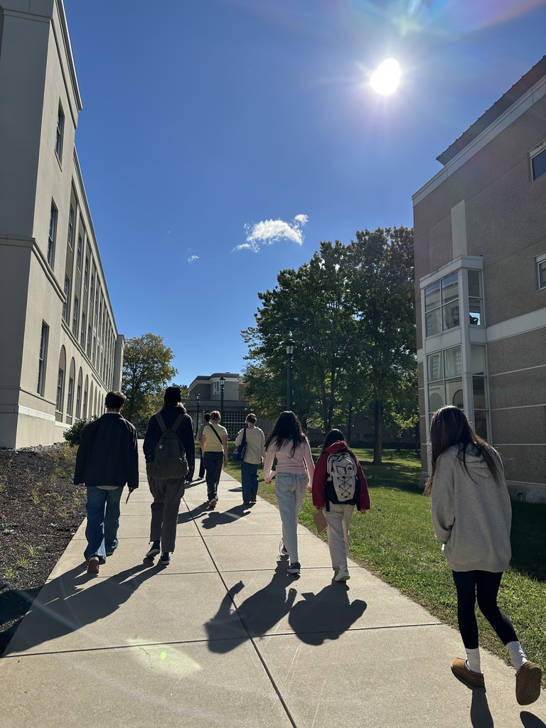 Shaker students walk down the sidewalk during a tour of campus.