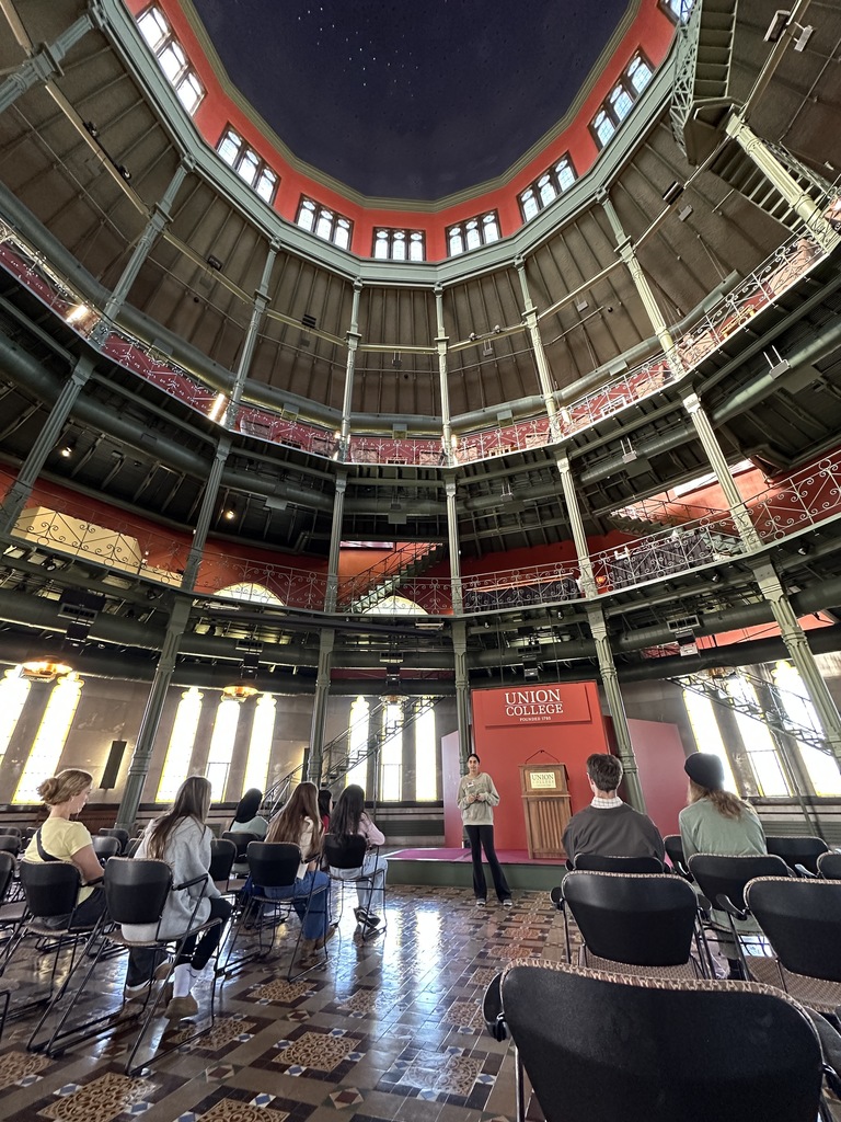 A Union student tour guide shows students inside the Nott Memorial on campus.