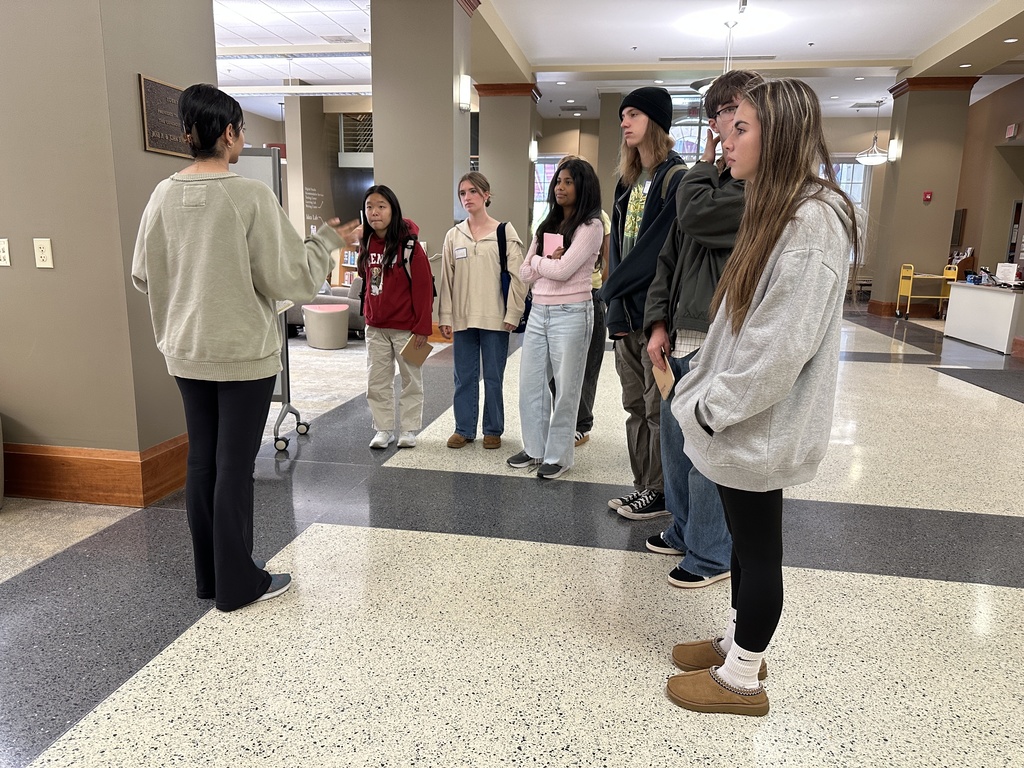 A Union student tour guide introduces Shaker students to the library on campus.
