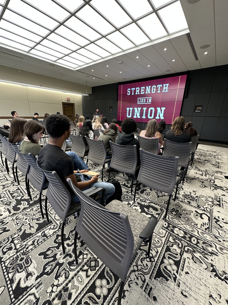 Students sit through a presentation about Union College by the admissions team.