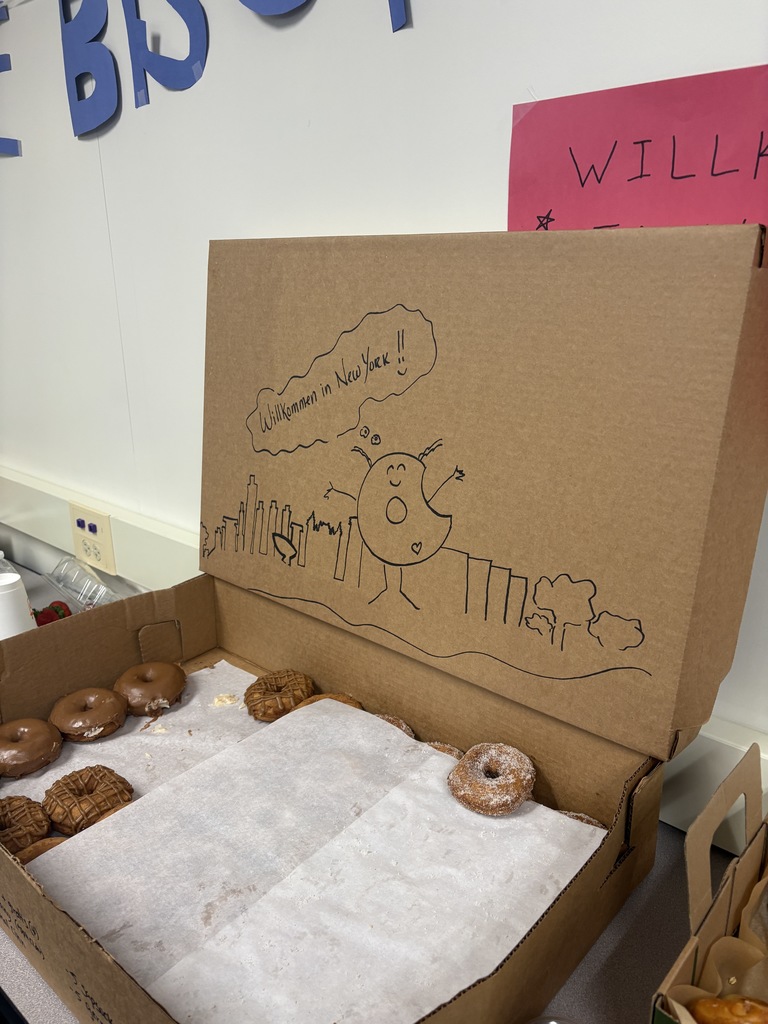 Donuts with a cute drawing welcoming the German exchange students