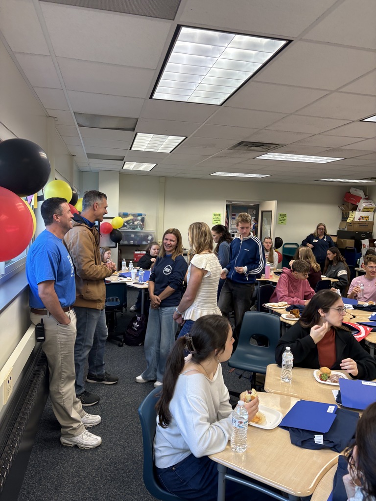 Students enjoy breakfast and teachers chatting