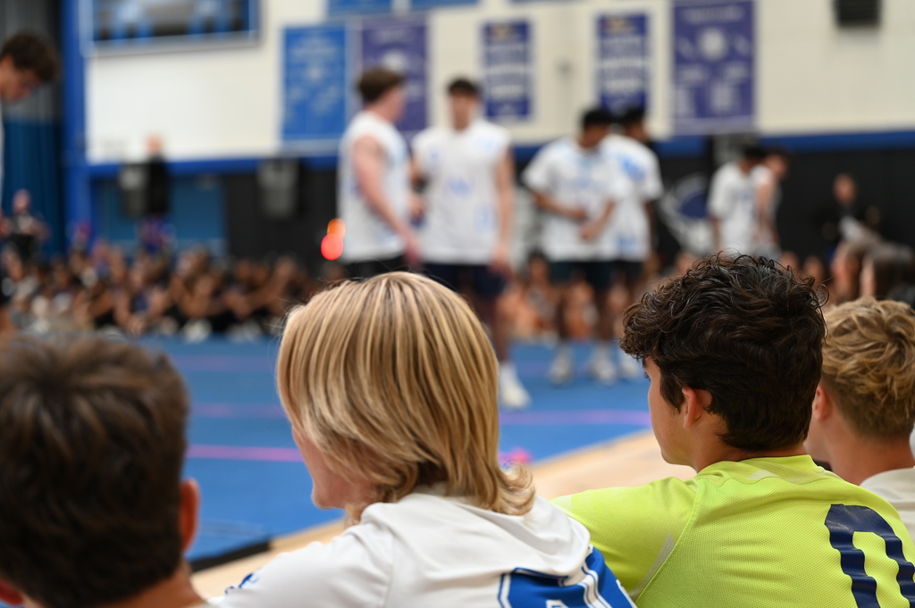 Varsity boys soccer team watches the senior boys dance