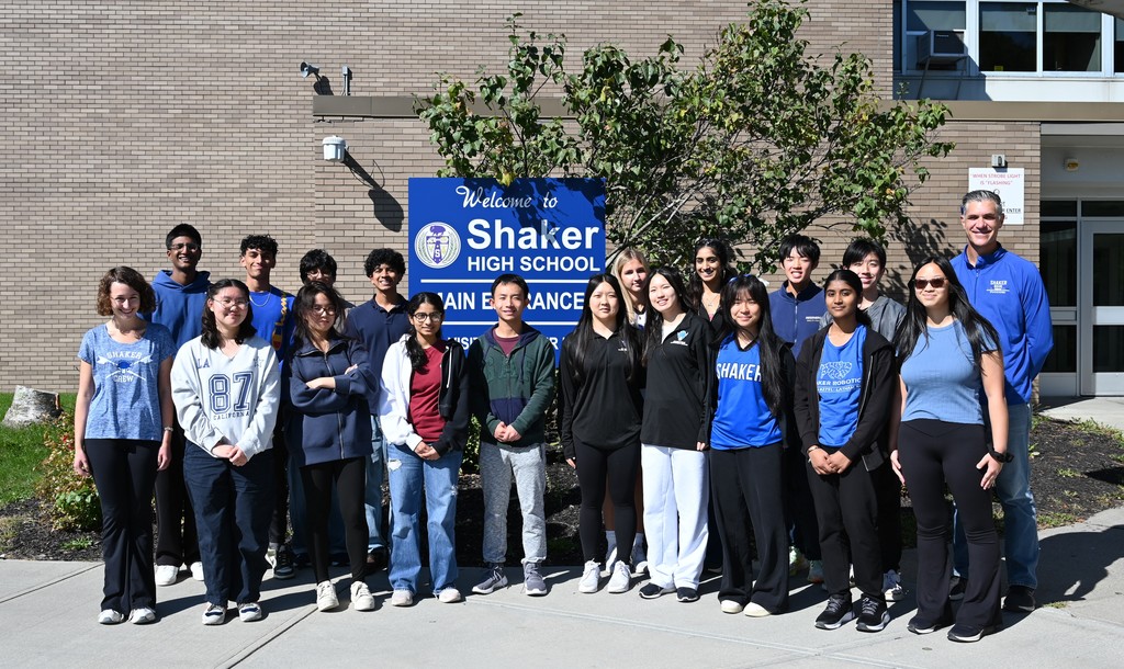 An image of 21 Shaker seniors who have been named Commended Students posing together with SHS Principal Marcus Puccioni.