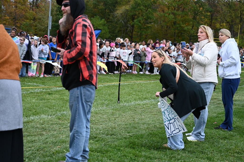 Parents, guardians and, staff cheer on students