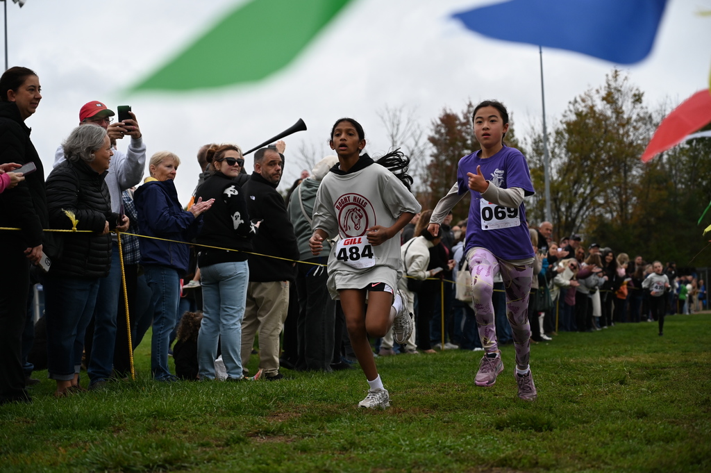 Neck and neck run to the finish line by the fifth grade girls