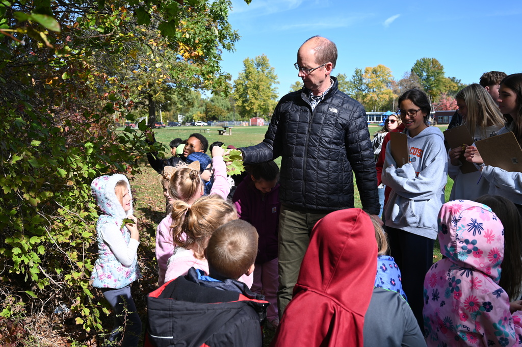 High School Environmental Science teacher Mr. Rodewald with 2nd grade Blue Creek students