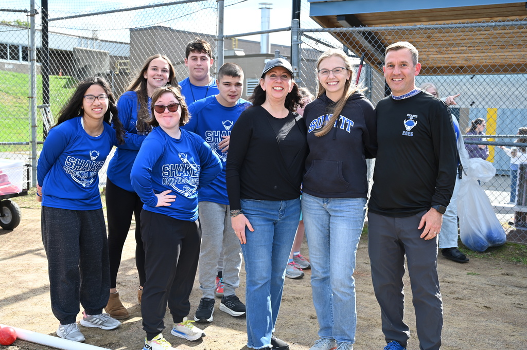 A Unified bocce team and faculty team pose before their match.