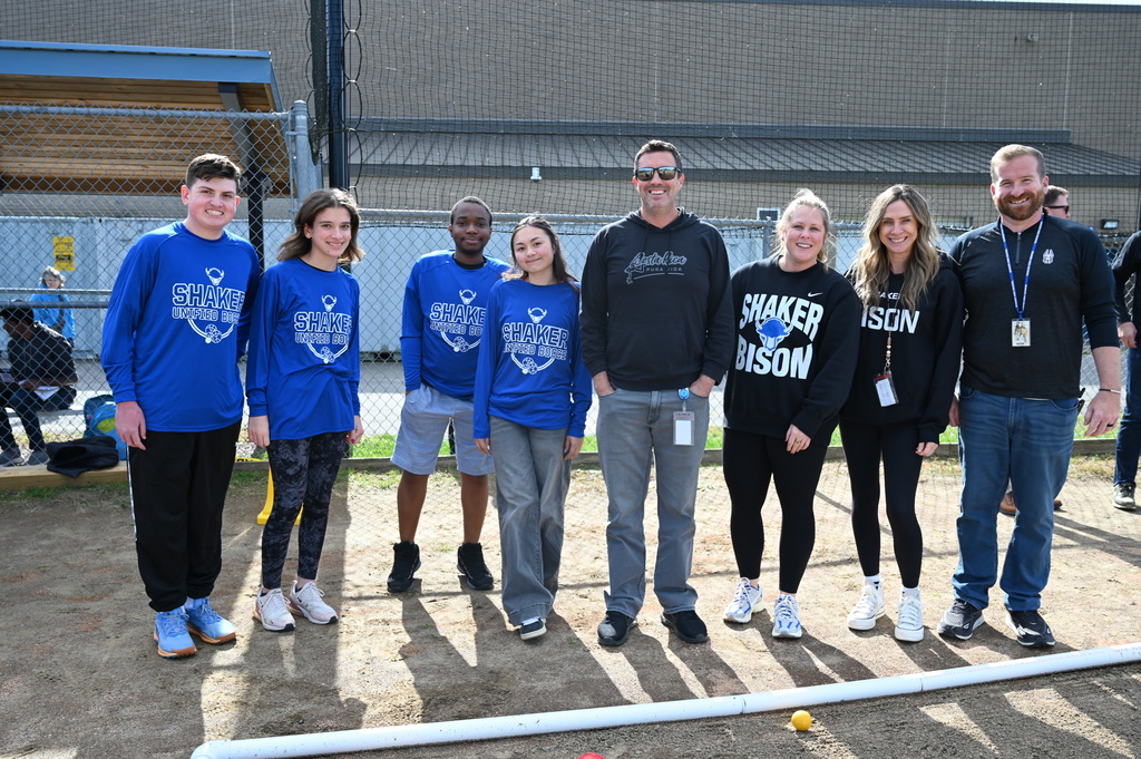 A Unified bocce team and faculty team pose before their match.