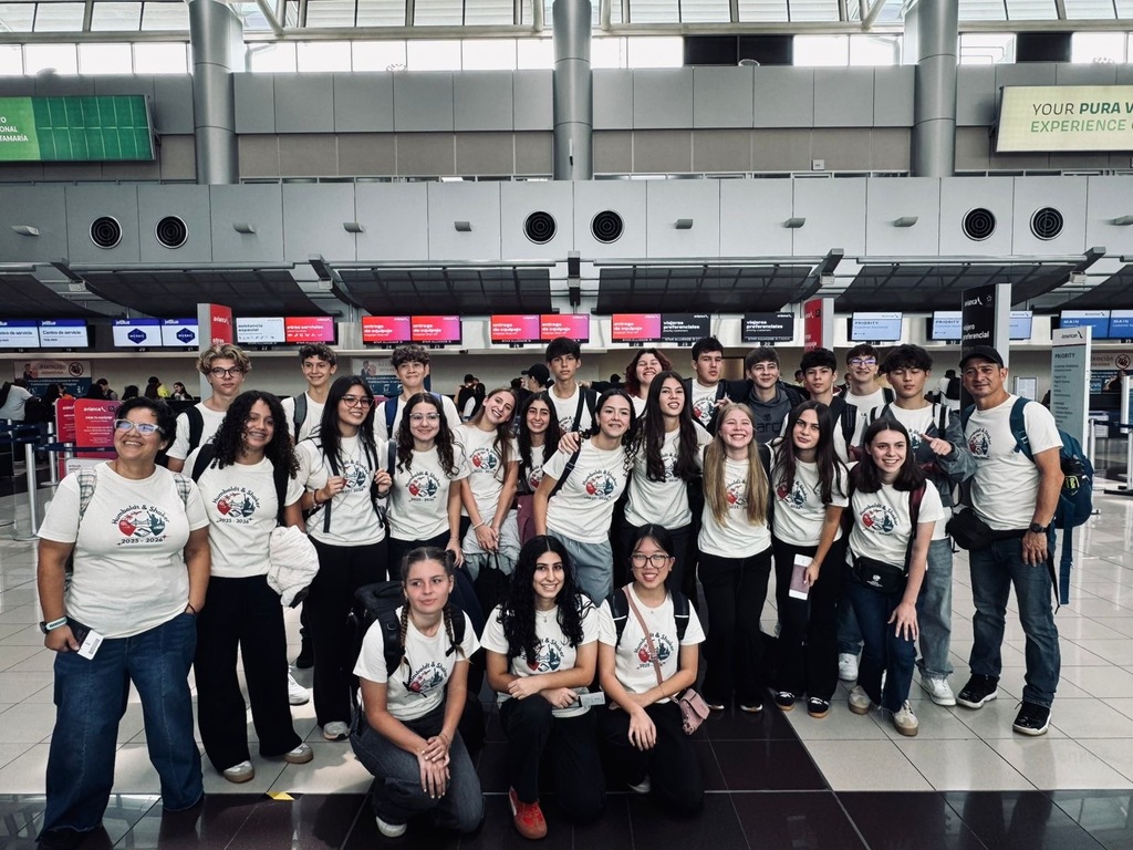 A group of exchange students from Costa Rica posing at the airport.