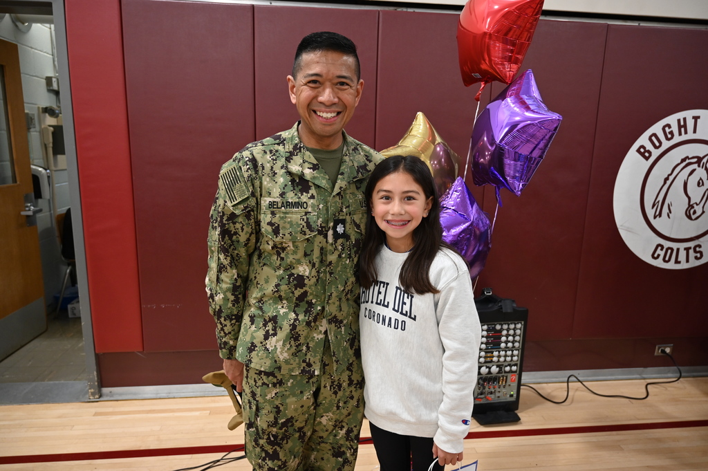 Commander James Belarmino from the U.S. Navy with his daughter