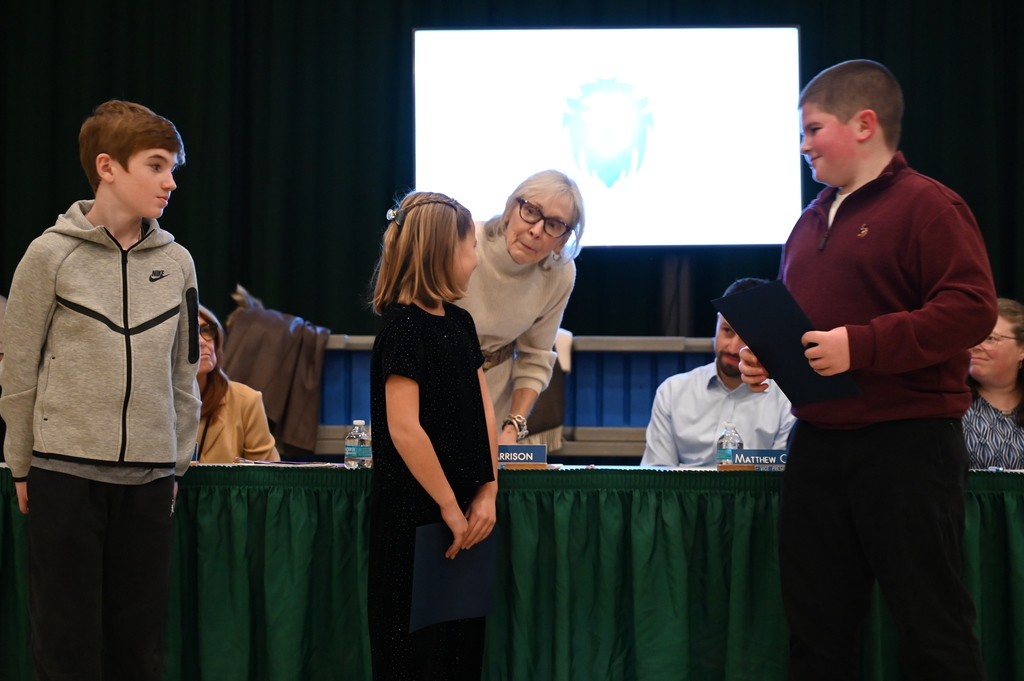 Board of Education President Mrs. Harrison, congratulates Nov. Kids Care recipients