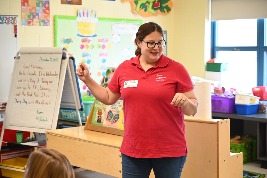 A representative of the Cornell Cooperative Extension speaks to a class of students.