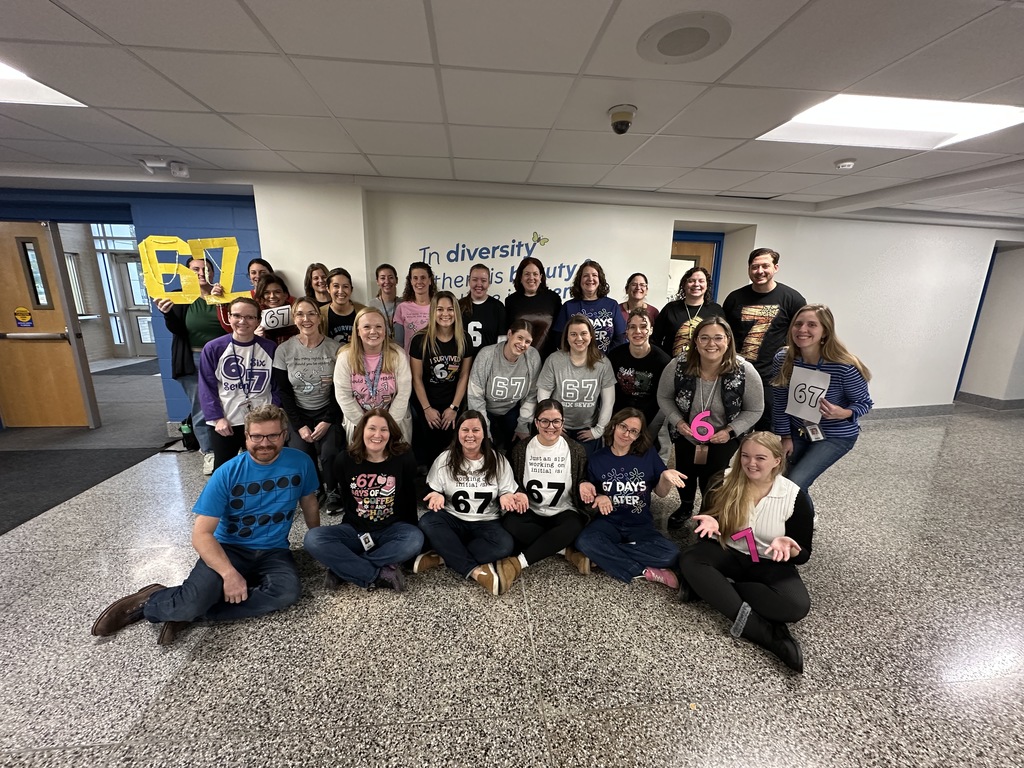 A large group of faculty and staff from Latham Ridge poses together in their 6-7 t-shirts.