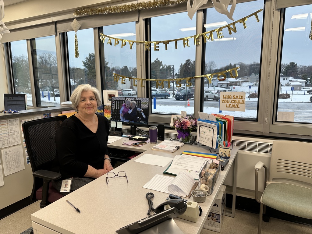 Mrs. Jeanne Meddleton sits behind her desk during her last week before retirement.