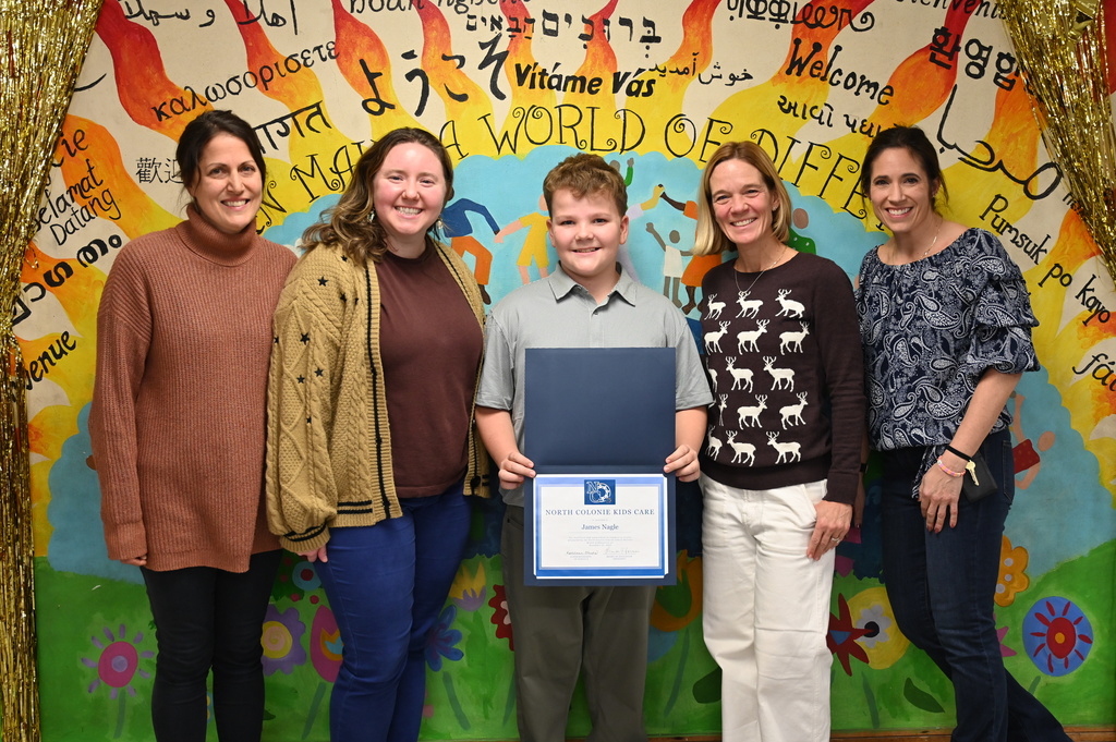 James Nagle poses with the four Boght Hills teachers who nominated him for the monthly award.