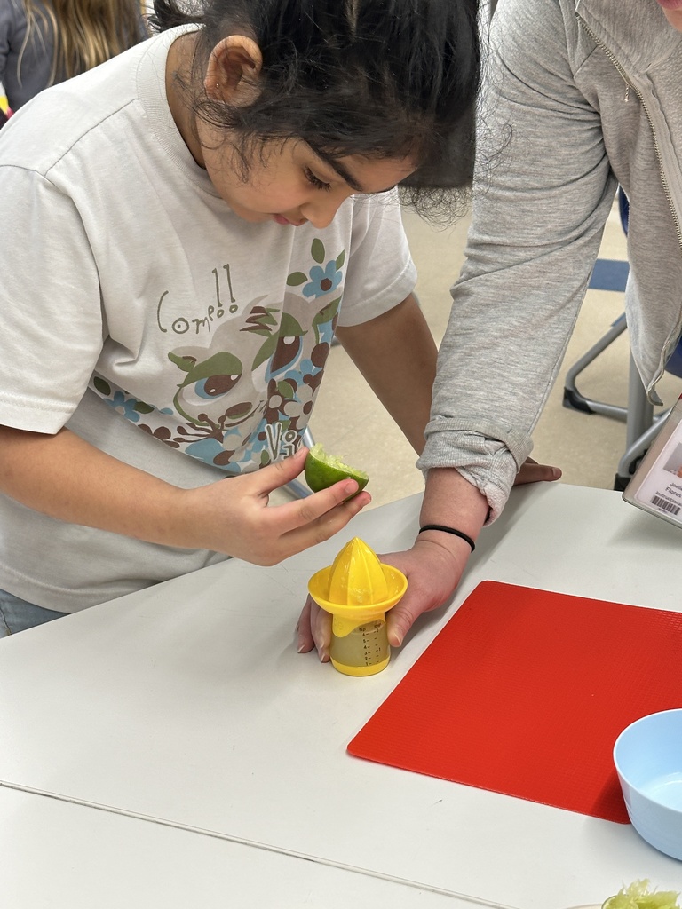 student squeezes lime