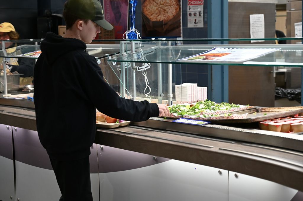 SMS Chef takeover student taking food from service line