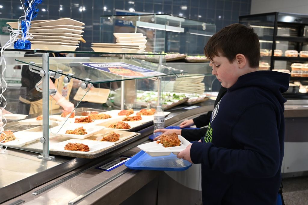 SMS Chef takeover student taking food from service line