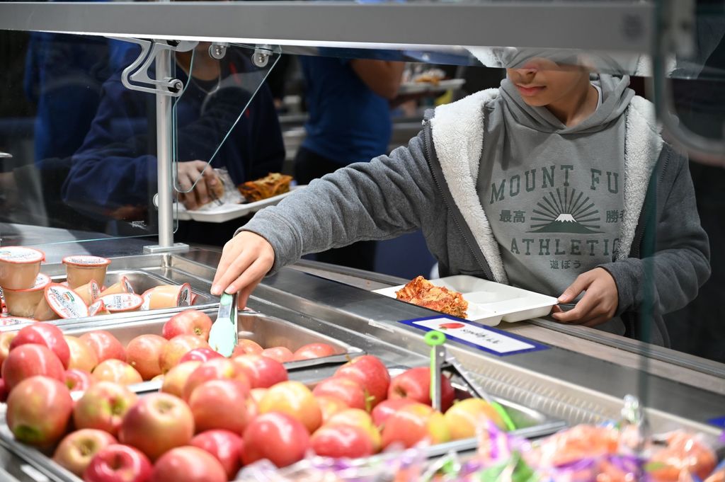 SMS Chef takeover student taking food from service line