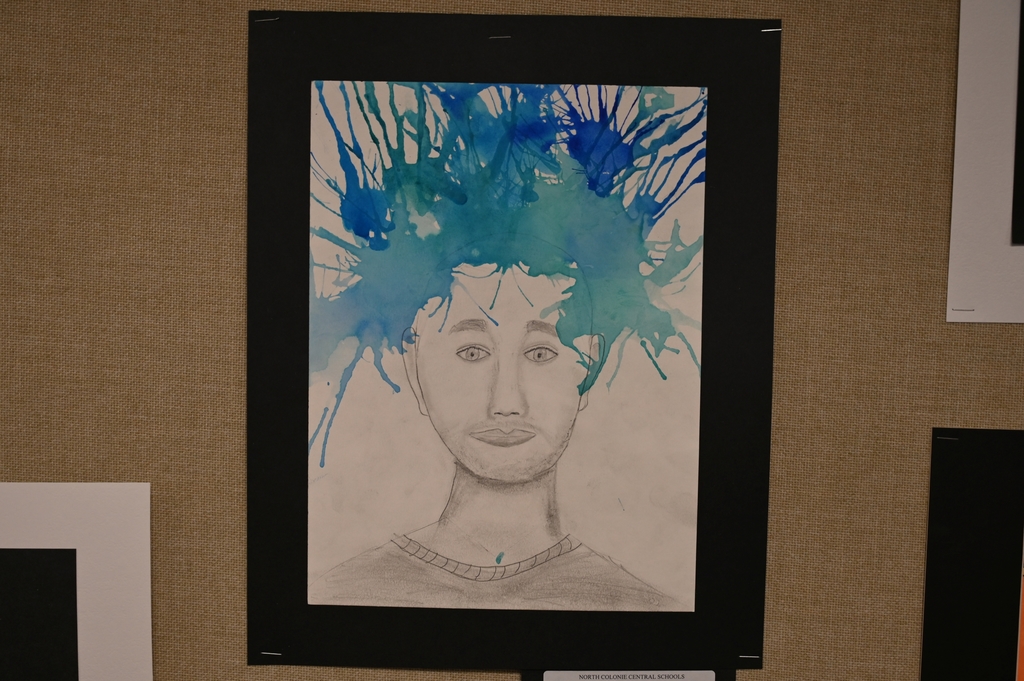 A work of art using pencil to draw a person and then shades of blue paint to represent hair.