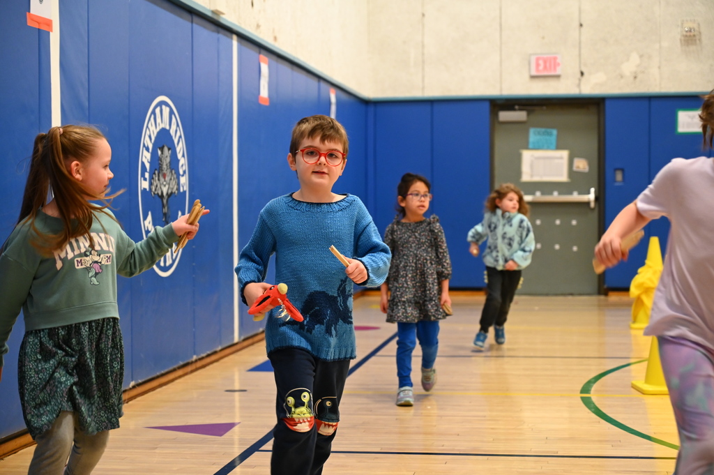 Running Club Students getting popsicle sticks
