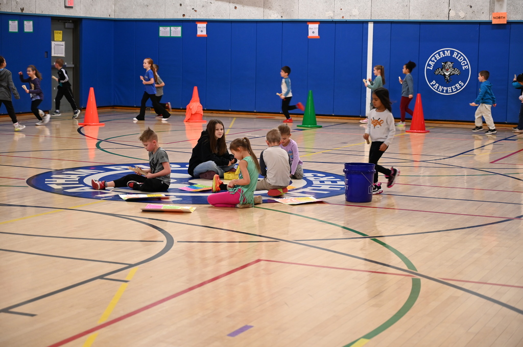 Running Club Students getting popsicle sticks