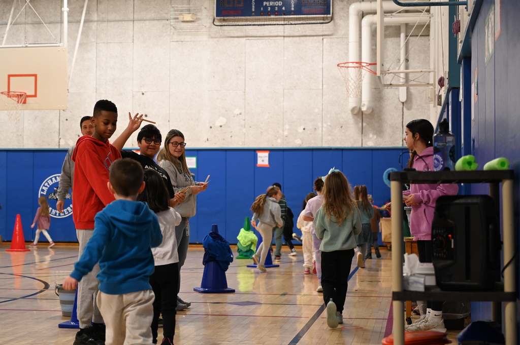 Running Club Students getting popsicle sticks