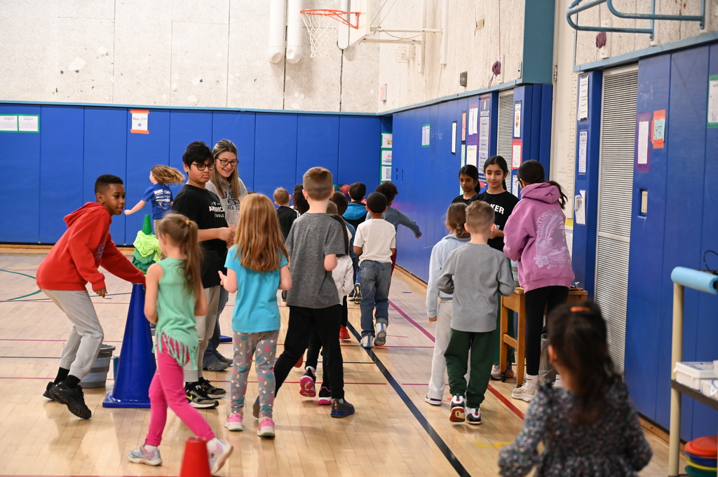 Running Club Students getting popsicle sticks