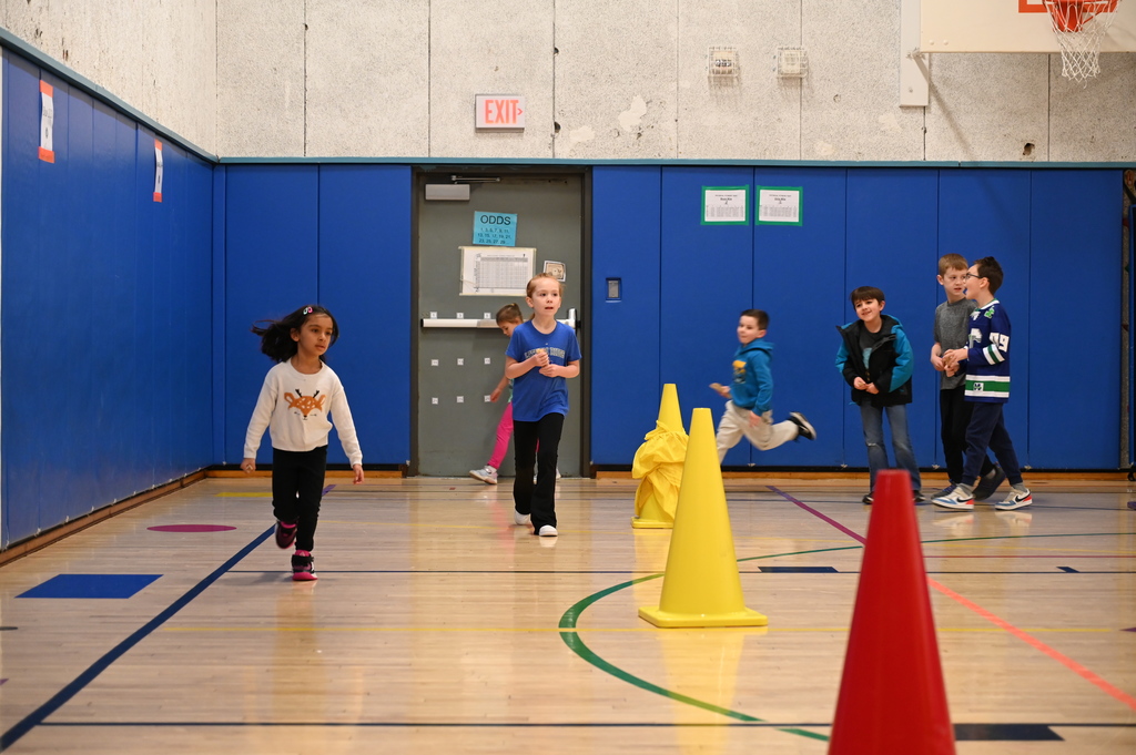 Running Club Students getting popsicle sticks