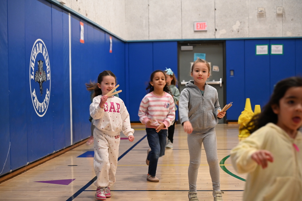 Running Club Students getting popsicle sticks