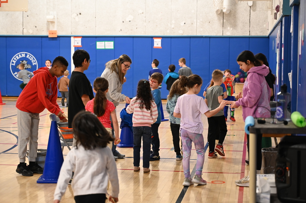 Running Club Students getting popsicle sticks