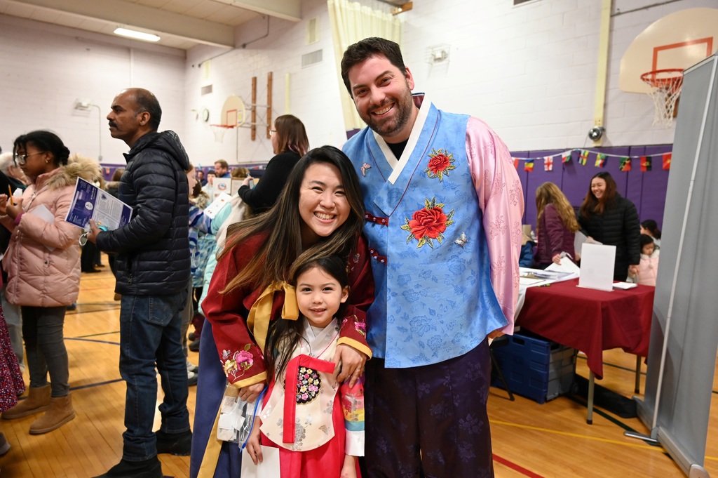 A family poses together as they enjoy the multicultural festival in the Southgate gymnasium.